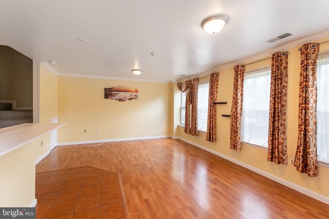6221 Sandpiper Ct Unit 7, Elkridge, MD 21075 - unfurnished living room with wood finished floors, plenty of natural light, and crown molding