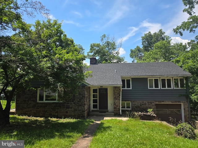 769 S Water St, Woodstock, VA 22664 - tri-level home featuring a chimney, a garage, brick siding, and roof with shingles