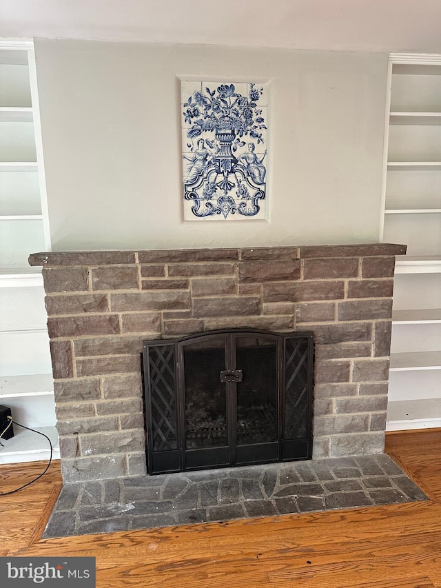 769 S Water St, Woodstock, VA 22664 - detailed view of a stone fireplace and wood finished floors