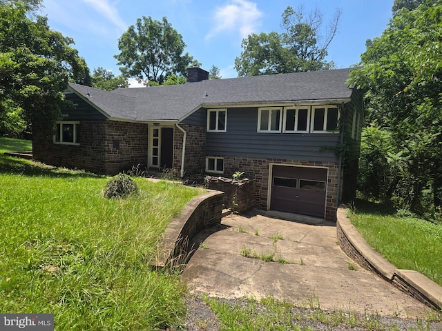 769 S Water St, Woodstock, VA 22664 - view of front of home featuring concrete driveway, stone siding, an attached garage, and a chimney