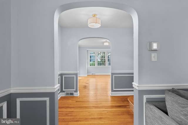 4 Haslet Way, Wilmington, DE 19807 - hall featuring arched walkways and wood finished floors