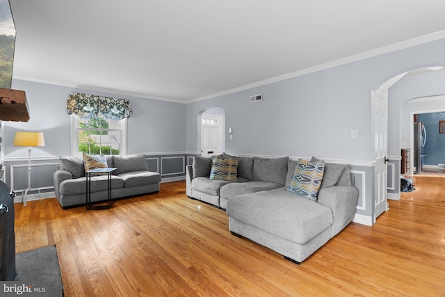 4 Haslet Way, Wilmington, DE 19807 - living area with arched walkways, wood finished floors, ornamental molding, and wainscoting