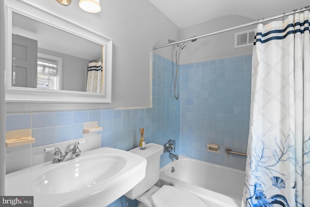 4 Haslet Way, Wilmington, DE 19807 - bathroom featuring shower / bathtub combination with curtain and tile walls
