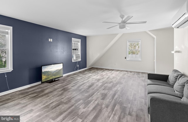4 Haslet Way, Wilmington, DE 19807 - living room with a wall mounted air conditioner, a ceiling fan, and wood finished floors