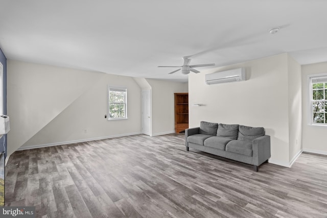 4 Haslet Way, Wilmington, DE 19807 - living room featuring a wall mounted AC, wood finished floors, and ceiling fan