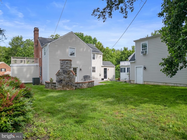4 Haslet Way, Wilmington, DE 19807 - rear view of property featuring a lawn, a chimney, and roof with shingles