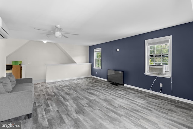 4 Haslet Way, Wilmington, DE 19807 - unfurnished living room with wood finished floors, a ceiling fan, a wall unit AC, and cooling unit