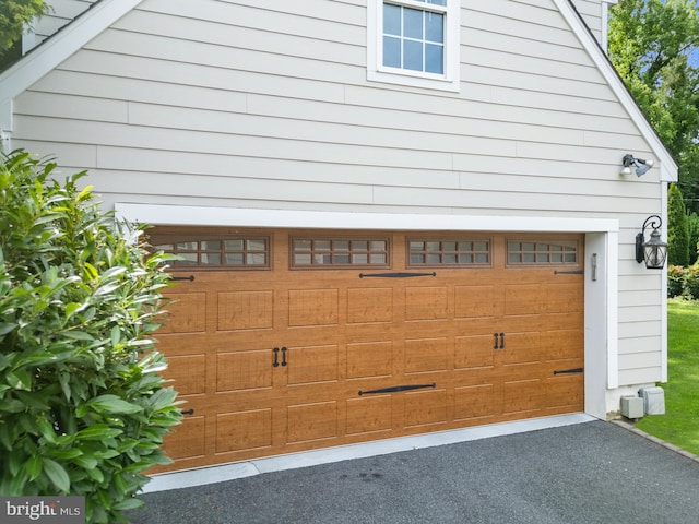 4 Haslet Way, Wilmington, DE 19807 - garage featuring asphalt driveway