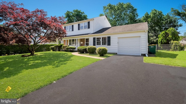 237 Louise Dr, Morrisville, PA 19067 - traditional home with a garage and asphalt driveway