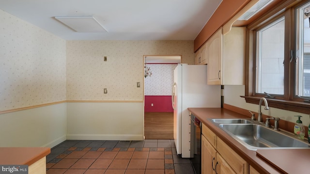 237 Louise Dr, Morrisville, PA 19067 - kitchen with tile patterned flooring, black dishwasher, a wainscoted wall, and light brown cabinets