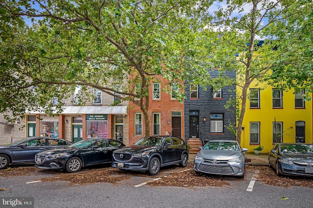 1717 Bank St, Baltimore, MD 21231 - townhome / multi-family property featuring brick siding and uncovered parking
