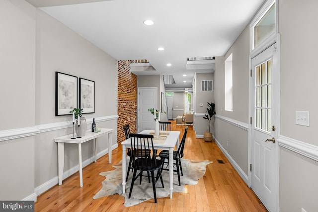 1717 Bank St, Baltimore, MD 21231 - dining space featuring light wood finished floors, recessed lighting, and brick wall