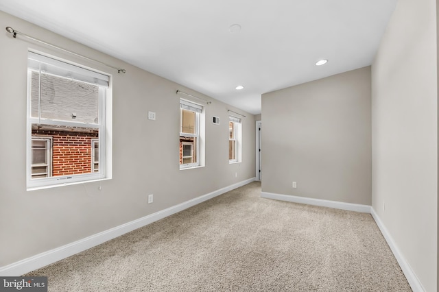 1717 Bank St, Baltimore, MD 21231 - carpeted empty room with baseboards and recessed lighting