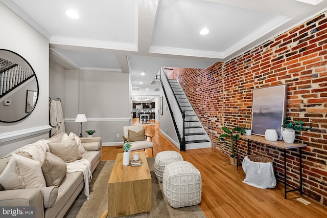 1717 Bank St, Baltimore, MD 21231 - living area with stairway, brick wall, wood finished floors, crown molding, and recessed lighting
