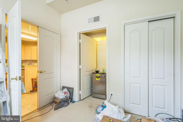 7206 Paperbark Ter, Laurel, MD 20707 - bedroom with refrigerator, light tile patterned floors, and a closet