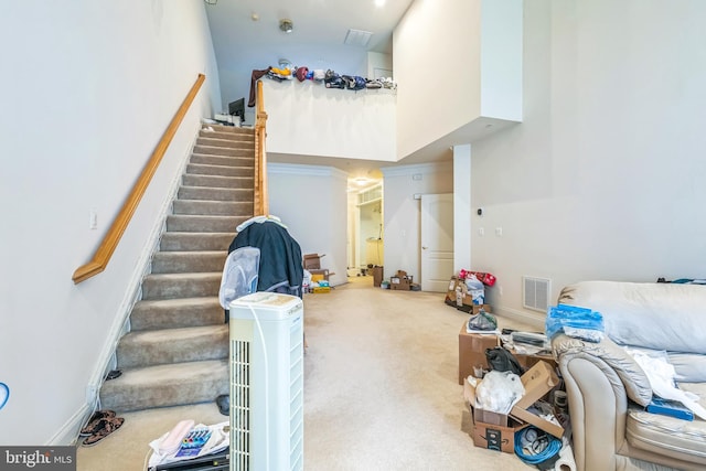 7206 Paperbark Ter, Laurel, MD 20707 - carpeted living area featuring stairway and a high ceiling