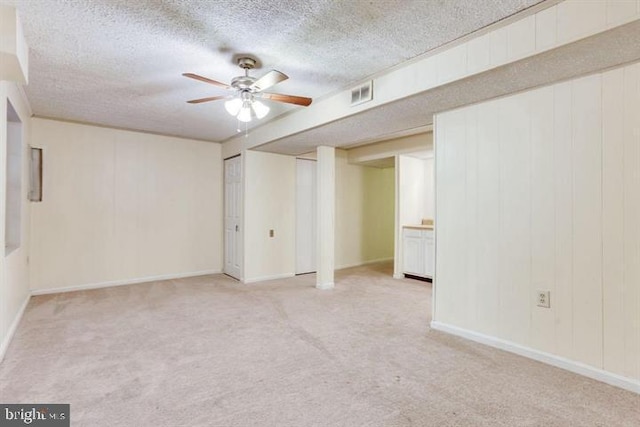 15246 Streamside Ct, Dumfries, VA 22025 - finished below grade area featuring carpet floors, a textured ceiling, and ceiling fan