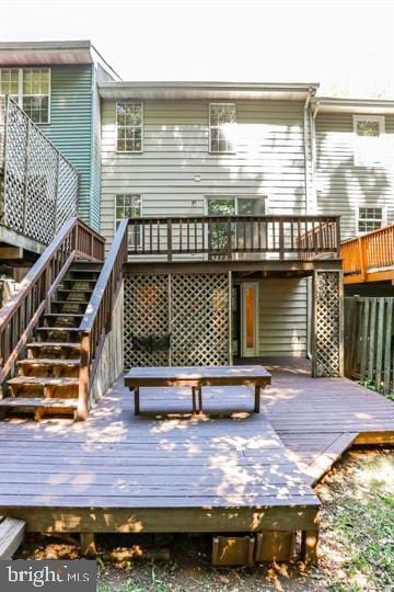 15246 Streamside Ct, Dumfries, VA 22025 - rear view of house featuring stairs and a wooden deck