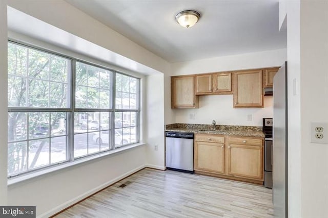 15246 Streamside Ct, Dumfries, VA 22025 - kitchen with stainless steel dishwasher, light wood-style floors, and dark stone countertops