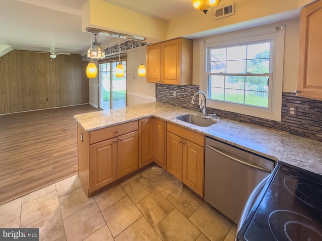35 Gentry Ln, Willingboro, NJ 08046 - kitchen with dishwasher, electric range, decorative backsplash, light stone countertops, and wood walls