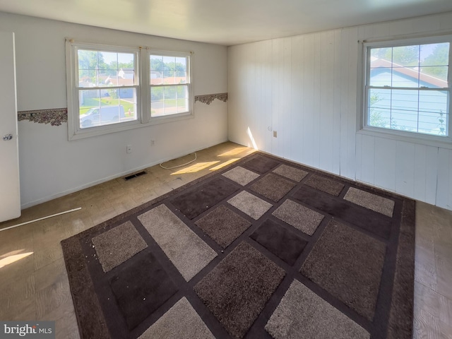 35 Gentry Ln, Willingboro, NJ 08046 - empty room featuring plenty of natural light and wooden walls