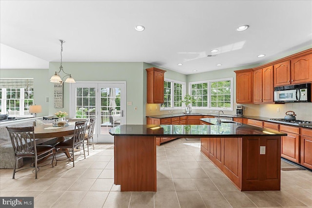 4 William Howard Dr, Glen Mills, PA 19342 - kitchen with stainless steel appliances, an island with sink, healthy amount of natural light, backsplash, and recessed lighting