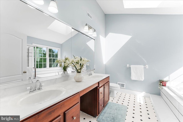 4 William Howard Dr, Glen Mills, PA 19342 - bathroom featuring a skylight, double vanity, a bath, and tile patterned floors