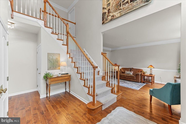 4 William Howard Dr, Glen Mills, PA 19342 - stairway featuring hardwood / wood-style flooring, ornamental molding, and a high ceiling