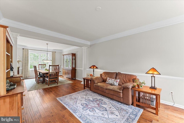 4 William Howard Dr, Glen Mills, PA 19342 - living room featuring hardwood / wood-style floors, ornamental molding, and ornate columns