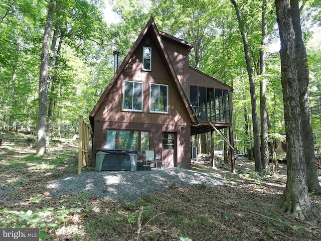 13 Mountainside Dr, Berkeley Springs, WV 25411 - view of front facade with a hot tub and a sunroom
