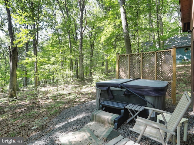 13 Mountainside Dr, Berkeley Springs, WV 25411 - deck with a hot tub and a forest view
