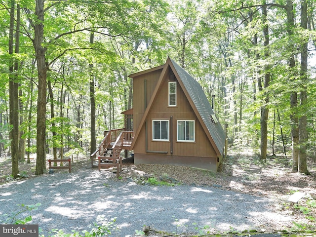 13 Mountainside Dr, Berkeley Springs, WV 25411 - rear view of property with a shingled roof and a view of trees