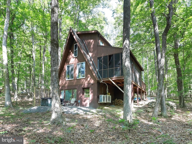 13 Mountainside Dr, Berkeley Springs, WV 25411 - view of front of home featuring a sunroom, stairway, and cooling unit