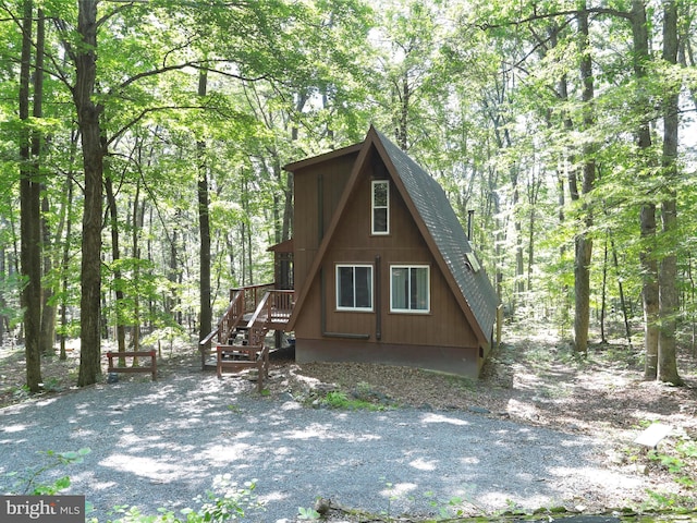 13 Mountainside Dr, Berkeley Springs, WV 25411 - view of front of house with roof with shingles and a forest view