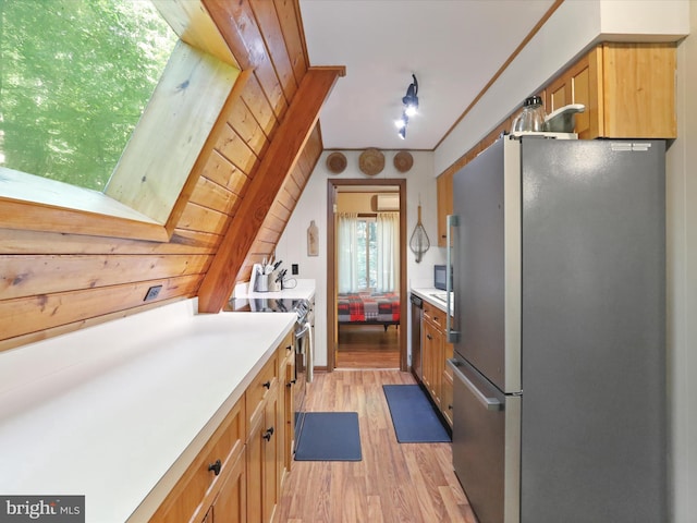13 Mountainside Dr, Berkeley Springs, WV 25411 - kitchen with stainless steel appliances, light wood-style flooring, and light countertops