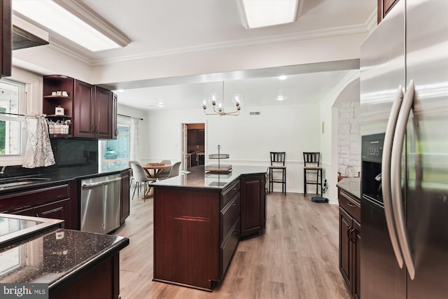 12116 Long Ridge Ln, Bowie, MD 20715 - kitchen with stainless steel appliances, light wood finished floors, a chandelier, crown molding, and open shelves