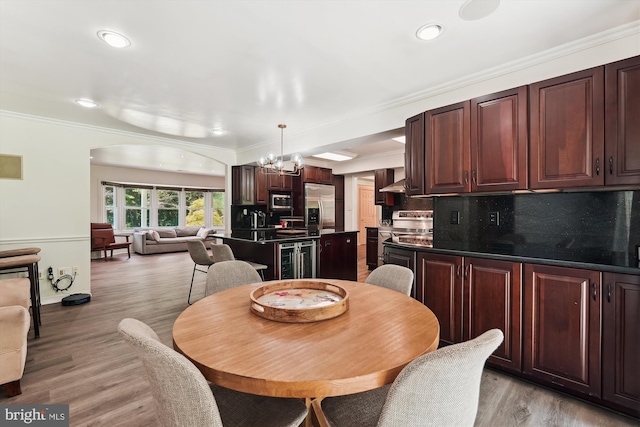 12116 Long Ridge Ln, Bowie, MD 20715 - dining space with a chandelier, crown molding, arched walkways, light wood-style flooring, and beverage cooler