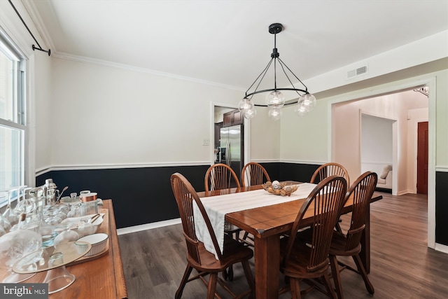 12116 Long Ridge Ln, Bowie, MD 20715 - dining area featuring dark wood-type flooring, ornamental molding, and a chandelier