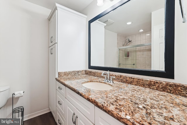 12116 Long Ridge Ln, Bowie, MD 20715 - bathroom featuring a stall shower, vanity, wood finished floors, and recessed lighting