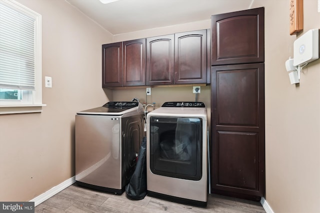 12116 Long Ridge Ln, Bowie, MD 20715 - laundry area with washing machine and clothes dryer, cabinet space, and light wood finished floors