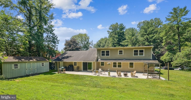 12116 Long Ridge Ln, Bowie, MD 20715 - back of property featuring a patio area, a lawn, and a storage unit