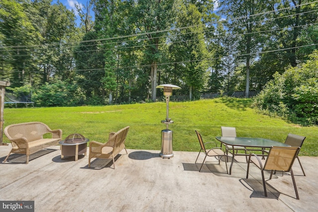 12116 Long Ridge Ln, Bowie, MD 20715 - view of patio featuring an outdoor fire pit, a trampoline, outdoor dining space, and view of scattered trees