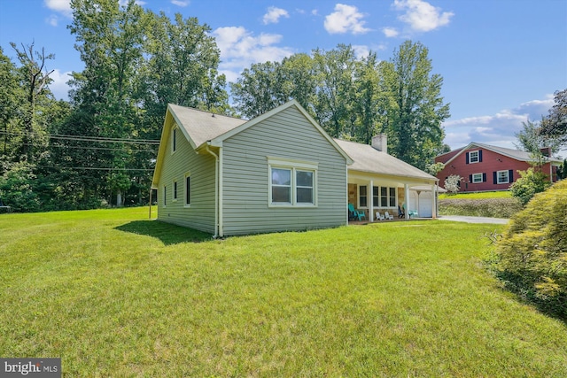 12116 Long Ridge Ln, Bowie, MD 20715 - back of property with a lawn, an attached garage, a chimney, and driveway