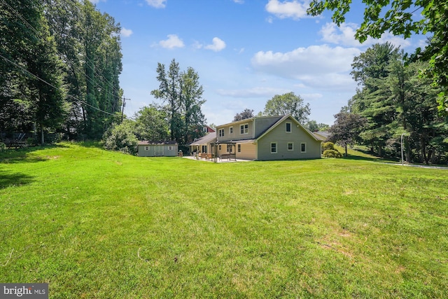 12116 Long Ridge Ln, Bowie, MD 20715 - view of grassy yard with an outdoor structure and a patio