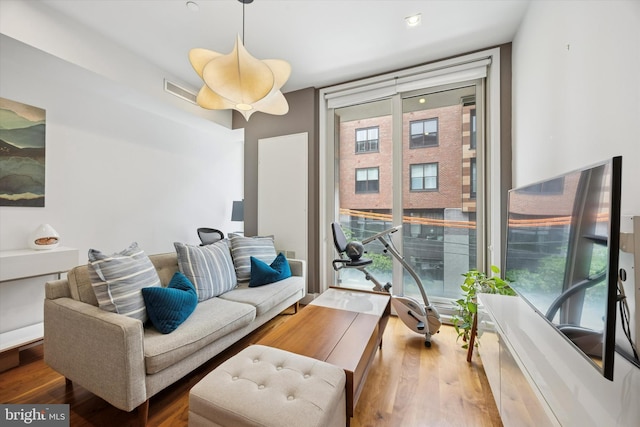 621 S 24th St Unit 204, Philadelphia, PA 19146 - living room featuring a wall of windows and wood finished floors