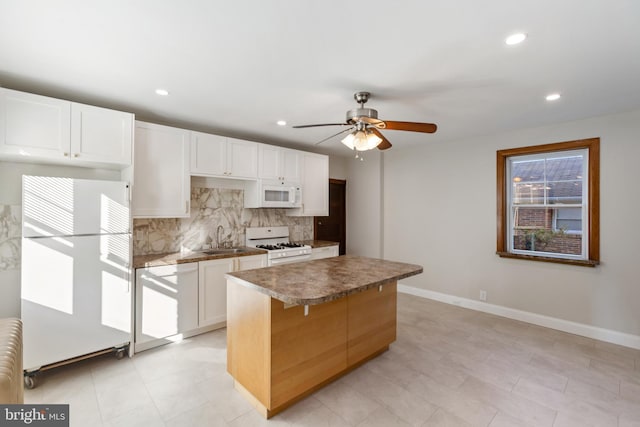 313 W 5th Ave, Conshohocken, PA 19428 - kitchen featuring white appliances, decorative backsplash, recessed lighting, a kitchen island, and a ceiling fan
