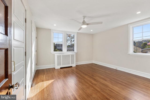 313 W 5th Ave, Conshohocken, PA 19428 - empty room featuring radiator heating unit, hardwood / wood-style flooring, a ceiling fan, and recessed lighting