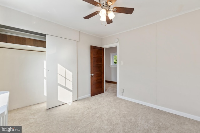 313 W 5th Ave, Conshohocken, PA 19428 - unfurnished bedroom with carpet flooring, a closet, crown molding, and ceiling fan