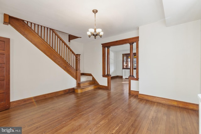 313 W 5th Ave, Conshohocken, PA 19428 - empty room featuring hardwood / wood-style flooring, stairs, and a chandelier