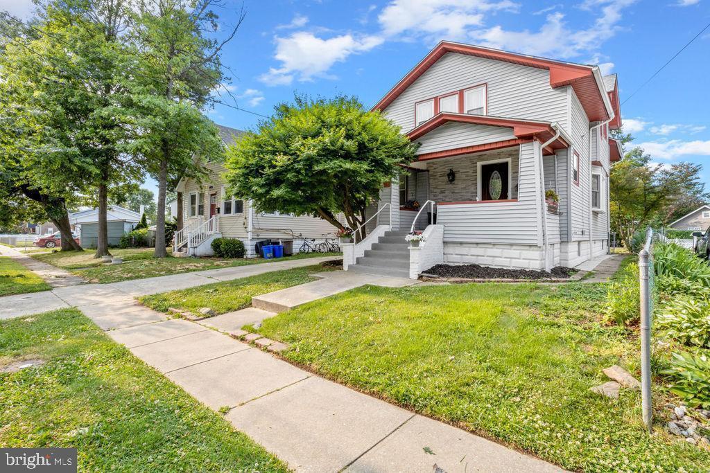 167 Kendall Blvd, Oaklyn, NJ 08107 - view of front of home with a front lawn, a porch, and a chimney